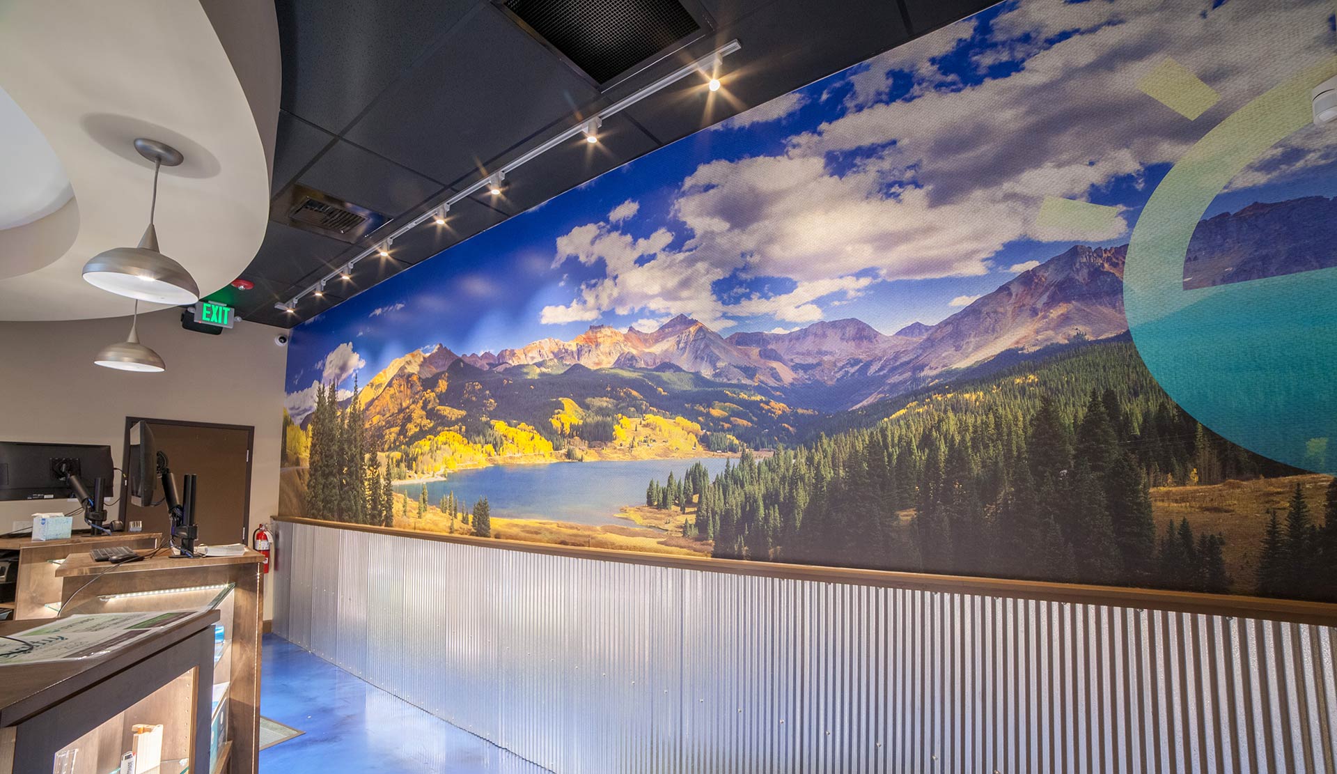 Large Wall Picture of Colorado Mountain Landscape with Lightshade Icon on wall inside the federal heights dispensary