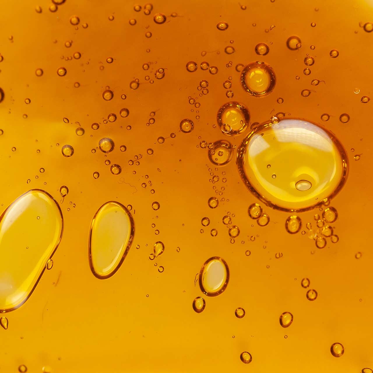 bubbles in amber colored distillate