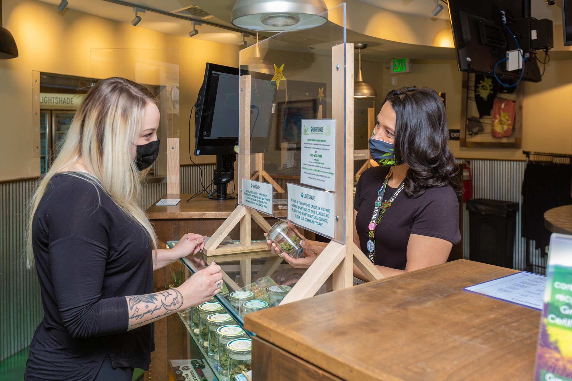 budtender and customer talking