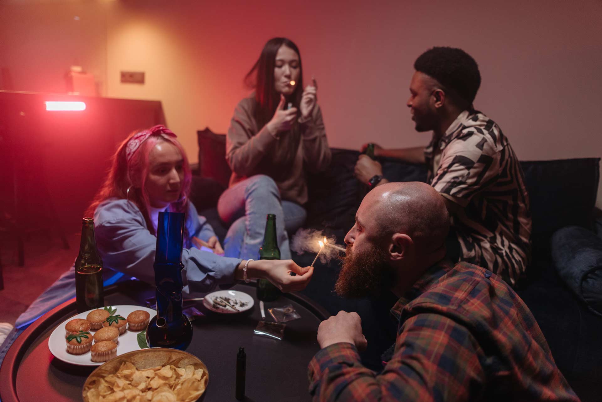 group of people smoking and eating cannabis cupcakes