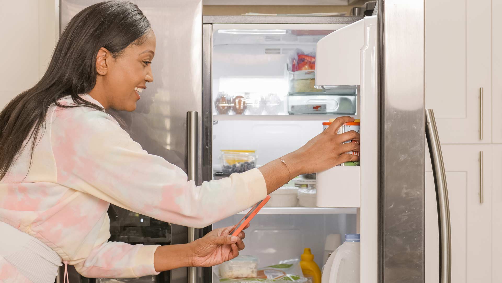 women checking the fridge for edibles